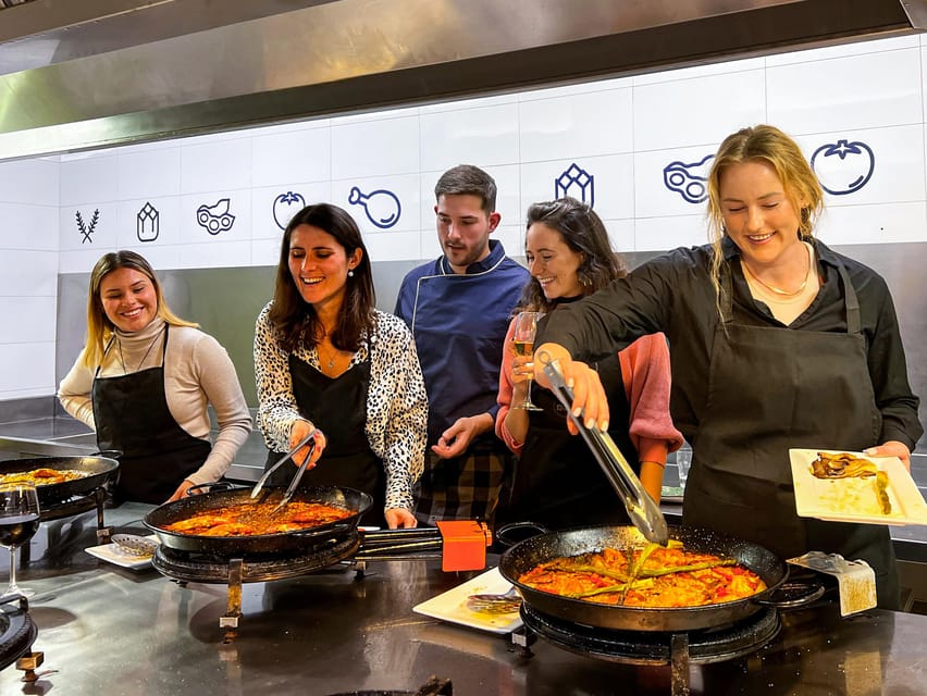 Valencia: Paella Cooking Class with Central Market Tour - A cooking station for one to three people