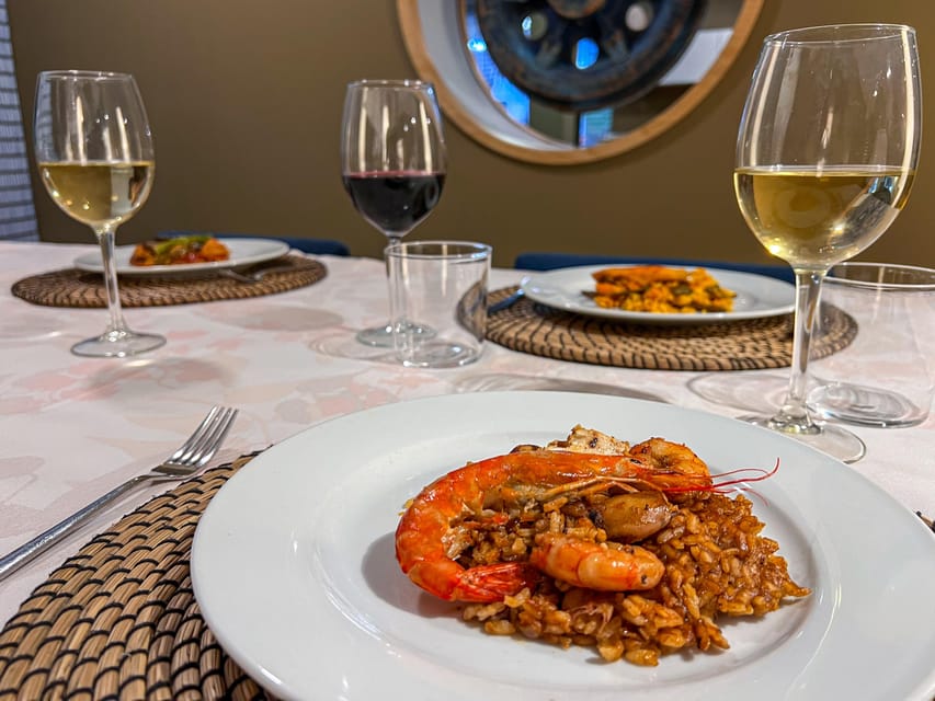 Valencia: Paella Cooking Class with Central Market Tour - The final meal at a shared table
