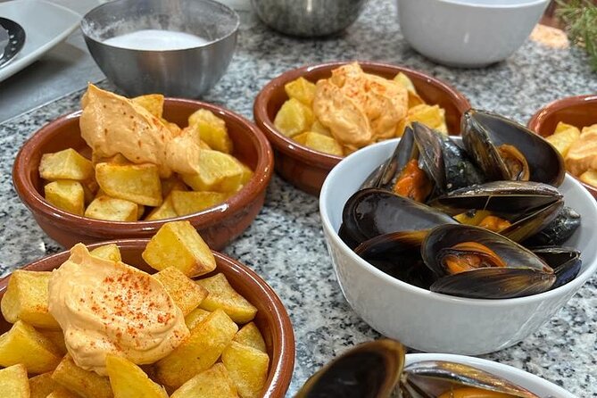 Valencian paella cooking class, tapas and visit to Ruzafa market. - Sitting down to the paella you helped prepare