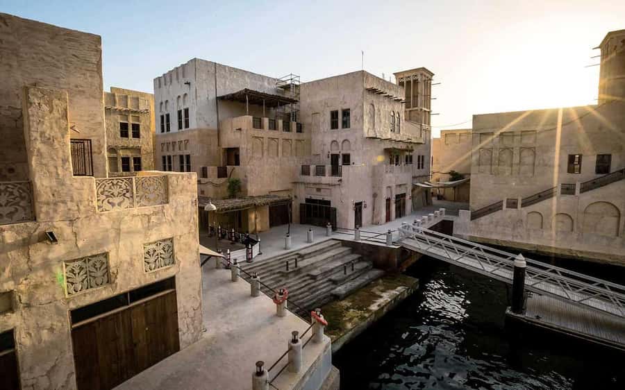 walking tour in old dubai, souks, abra boat, old town - Textile Market and Al Souq Al Kabeer